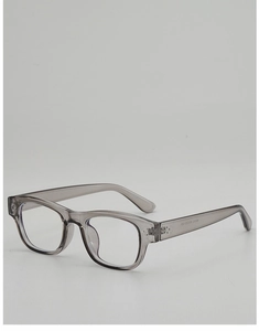 Macro detail of translucent gray square eyeglass frames with specifications on temples