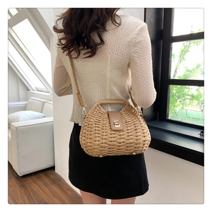 Minimalist beige woven straw shoulder bag with khaki leather flap and metal buckle