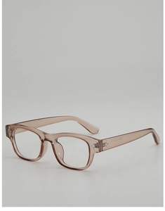 Detail of square tea-colored eyewear frame featuring silver rivets and clear lenses