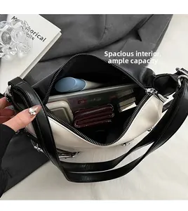 Interior view of black and white tote showing large capacity for tablet and essentials