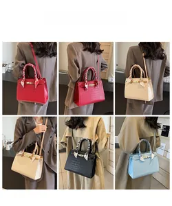 Crocodile pattern handbags in four colors styled with decorative silk scarf handles