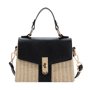 Minimalist woven handbag in contrast stitching with golden metal twist lock and shoulder strap