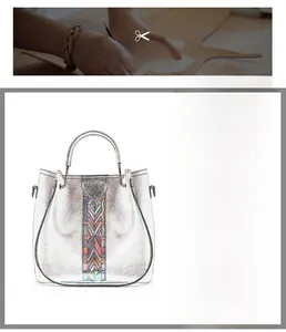 Détail du sac cabas argenté avec broderie géométrique colorée et poignée en métal