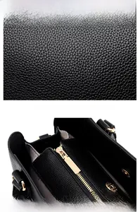 Close-up of black lychee grain leather texture and golden zipper detail on tote bag