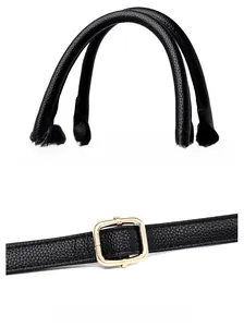 Detail of lychee pattern leather tote bag showing handle and adjustable golden buckle
