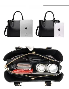 Detailed view of the black lychee pattern leather tote bag showing large capacity storage
