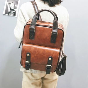 Brown vintage style faux leather large capacity backpack with flap and double buckle design