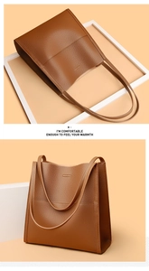 Close-up of brown lychee grain leather tote bag showing texture and handle details