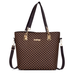 Vintage retro embossed tote bag with geometric pattern and adjustable shoulder strap