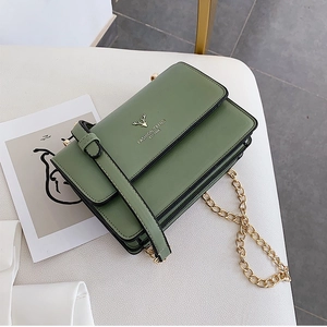 Morandi green chain crossbody bag with golden deer emblem and pebbled leather texture