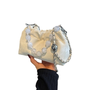 Chic pleated cream leather cloud bag with luxury faux pearl handles and chain strap