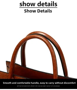 Detail view of the rounded handle and grain leather texture on a brown tote bag