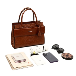 Top-down view of large capacity tote bag holding iPad, umbrella, and daily essentials