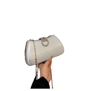 Elegant silver glitter evening clutch bag with sparkling rhinestone ring clasp and gold chain