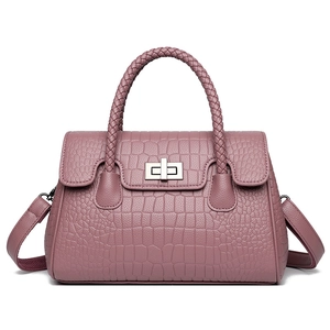 Crocodile embossed dusty rose handbag with woven handle and silver metal clasp lock