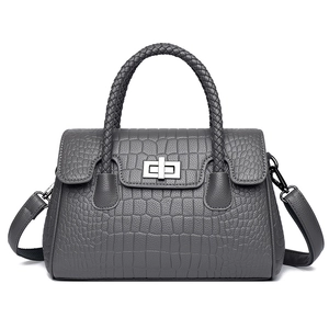 Grey crocodile embossed shoulder bag with woven handle and silver metal turn-lock