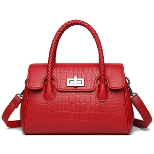 Elegant red crocodile pattern shoulder bag with woven handle and silver metal lock closure