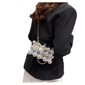 Chic silver metallic clutch with spherical mirror beads and a sleek chain strap