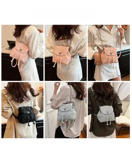 Quilted mini backpack with metal chain straps shown in pink, black and silver colors