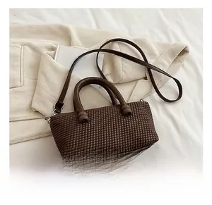 Detailed macro view of brown woven texture and stylish design on a chic tote bag