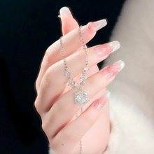 Detailed macro view of S925 silver necklace with square cubic zirconia and small side stones
