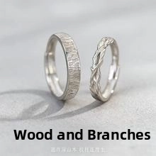 Macro detail of S925 sterling silver rings with natural wood grain and woven twig texture