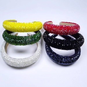 Close-up of padded crystal headbands showing dense beadwork and vibrant color options