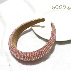 Detail of pink crystal beaded headband showing intricate handmade texture and soft fabric liner