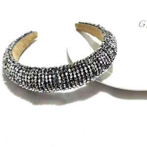 Close-up of grey crystal beaded padded headband with non-slip khaki inner lining