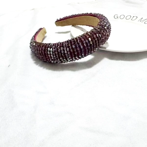 Macro detail of deep purple crystal beaded padded headband with non-slip fabric lining