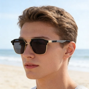 Detail of men's cat-eye sunglasses featuring black gold frames and checkered temples