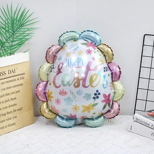 Detail of colorful egg-shaped foil balloon with Happy Easter text and floral patterns