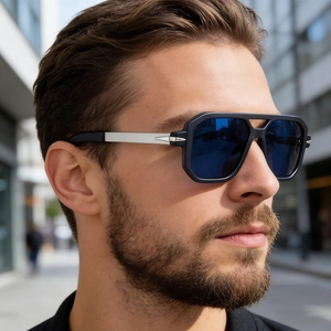 Close-up of polarized blue mirror sunglasses on a male model with metallic temple detail