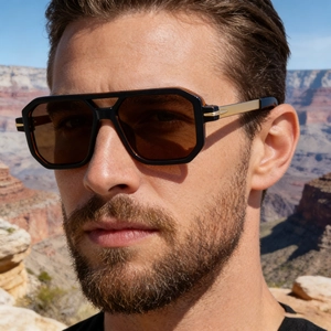Close-up of polarized square sunglasses for men featuring metal accents and a brown lens