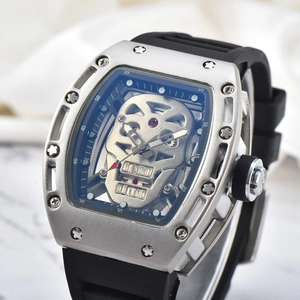 Men's silver tonneau watch featuring a hollow skull dial and black silicone strap
