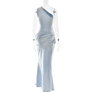 Detail of light blue satin one-shoulder dress with elegant pleated waist and drapes