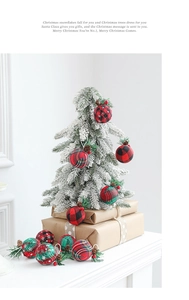Close-up of 5cm Christmas ball ornaments with pine cones, berries and plaid fabric texture