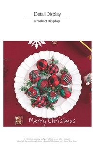 Detail display of Christmas ornaments with plaid fabric, pine needles and mini cones