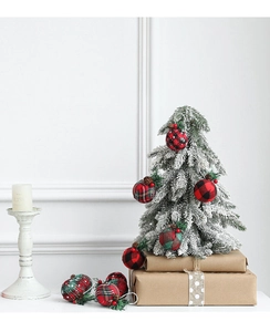 Detailed close-up of 5cm Christmas ball ornaments with pine needles and plaid fabric