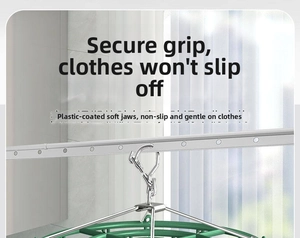 Detail of green multi-clip laundry drying rack showing non-slip soft rubber coated clips