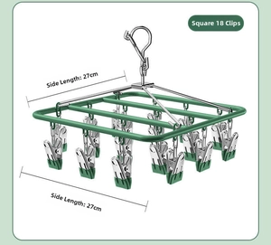 Detail showing a square green drying rack with 18 clips and 27cm side dimensions.