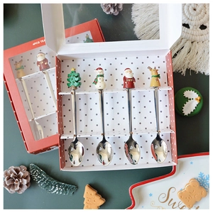 Detail of Christmas themed 304 stainless steel spoons in a red polka dot gift box