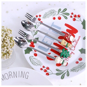 Detail view of 4-piece stainless steel Christmas spoons and forks set with festive figures