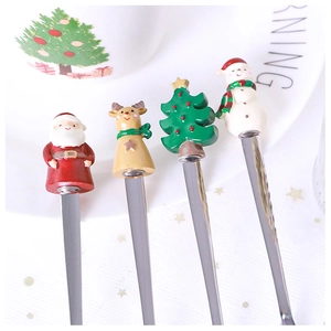 Detail of 304 stainless steel spoons featuring 3D Santa and Reindeer cartoon toppers