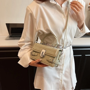 Chic light green crocodile embossed crossbody bag with silver buckle in office setting