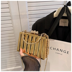 Golden vintage acrylic box clutch with vertical stripes and elegant metal chain strap