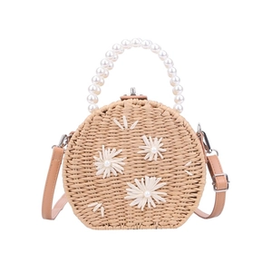 Woven straw bag with white flowers, pearl handle and brown leather shoulder strap