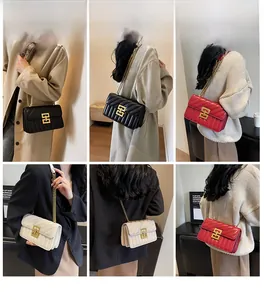 Detailed views of the V-quilted leather crossbody bag with golden chain and hardware