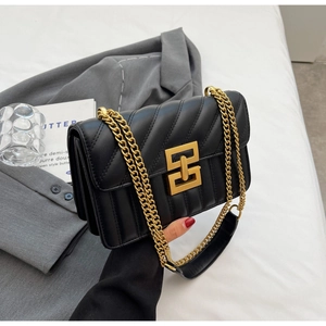 Chic black quilted crossbody bag with gold geometric lock and chain strap for women