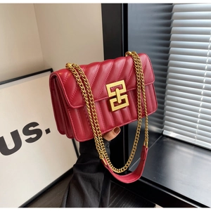 Elegant red quilted leather crossbody bag with gold chain strap and metal lock